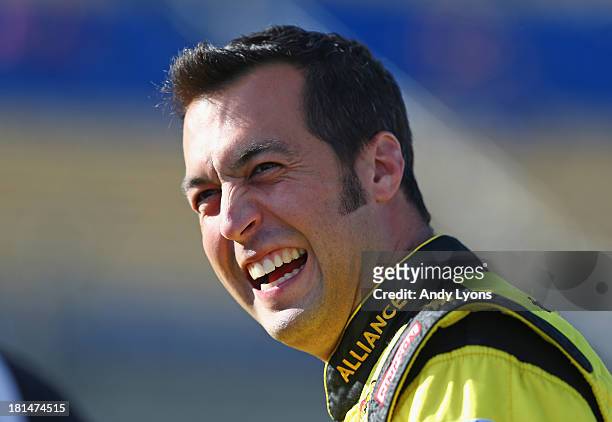 Sam Hornish Jr, driver of the Alliance Truck Parts Ford waits to qualify for the NASCAR Nationwide Series Kentucky 300 at Kentucky Speedway on...