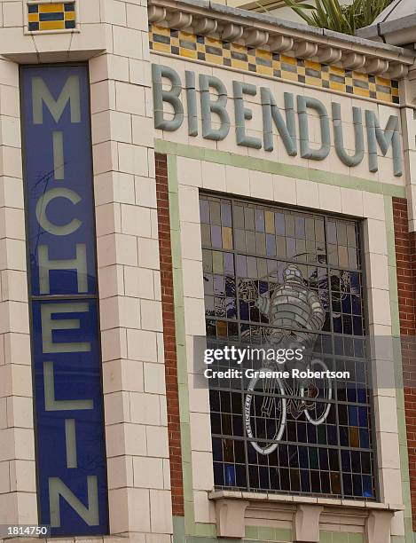 The Michelin Man logo is shown on the front of the Michelin headquarters February 25, 2003 in London. The French tire maker announced that its net...