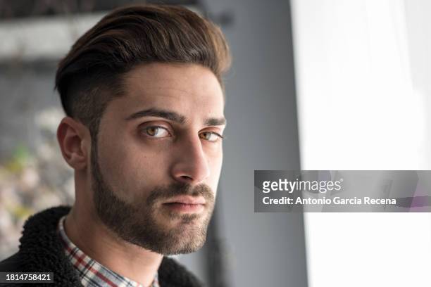 green eyes man looking at camera in head shot with window light - plaid shirt isolated stock pictures, royalty-free photos & images