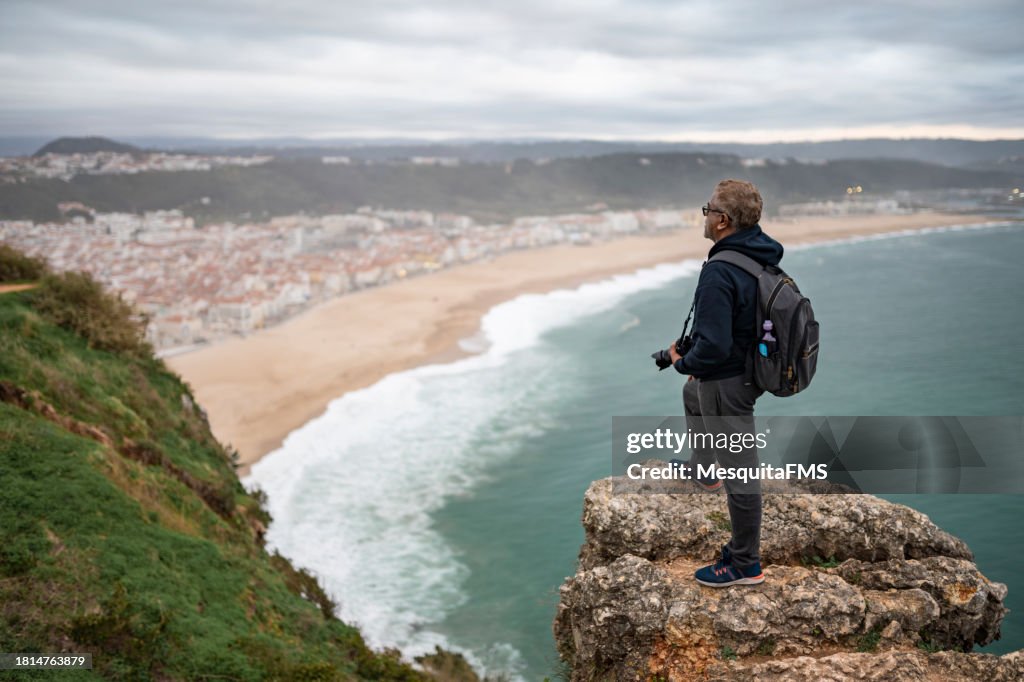 Tourist on Nazaré beach in Portugal