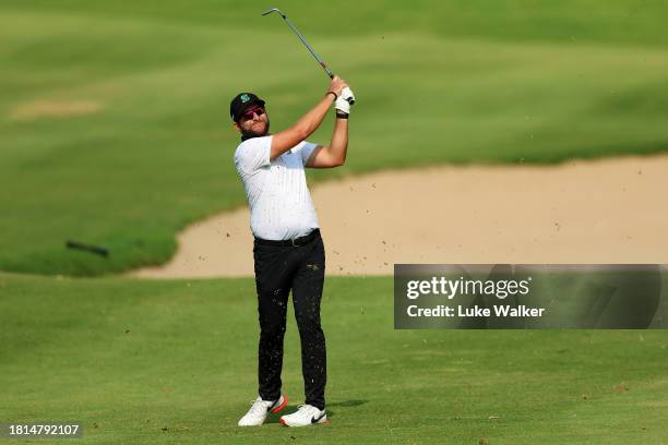 Dean Bermester of South Africa plays his second shot on the 17th hole during Day Four of the Joburg Open at Houghton GC on November 26, 2023 in...