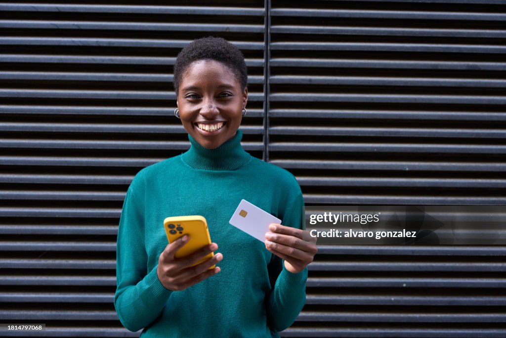 Digital Payment - Smiling Woman with Card and Smartphone