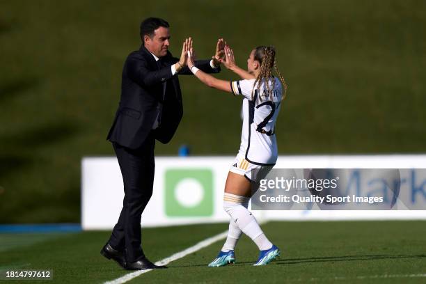 Athenea del Castillo of Real Madrid celebrates after scoring her team's first goal with her coach Alberto Toril during Liga F match between Real...