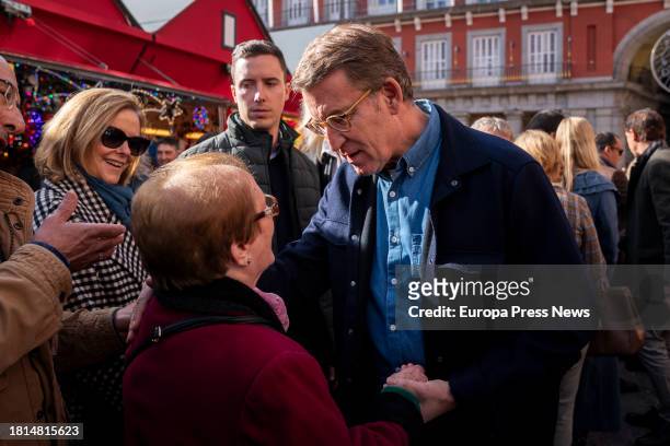 The president of the Partido Popular, Alberto Nuñez Feijoo, visits the Christmas market at the Plaza Mayor in Madrid, on 26 November, 2023 in Madrid,...