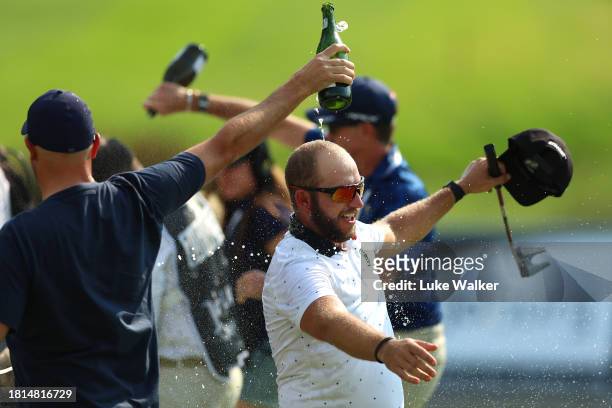 Dean Bermester of South Africa celebrates victory on the 18th green after winning during Day Four of the Joburg Open at Houghton GC on November 26,...