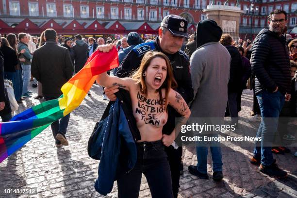 Femen activist protests during the visit of the president of the Popular Party, Alberto Nuñez Feijoo, and the president of the Community of Madrid,...