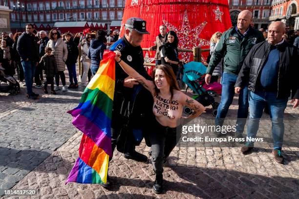 Femen activist protests during the visit of the president of the Popular Party, Alberto Nuñez Feijoo, and the president of the Community of Madrid,...