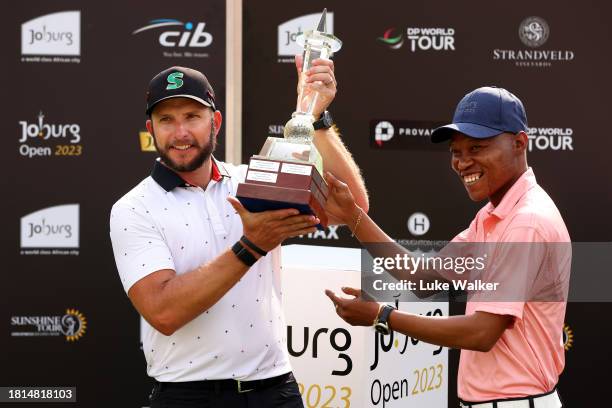 Dean Bermester of South Africa is presented with the trophy by Kabelo Gwamanda, Mayor of Johannesburg after winning during Day Four of the Joburg...