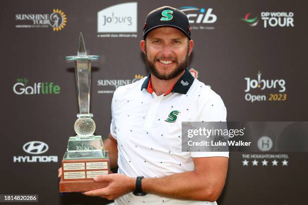 Dean Bermester of South Africa celebrates with the trophy after winning during Day Four of the Joburg Open at Houghton GC on November 26, 2023 in...