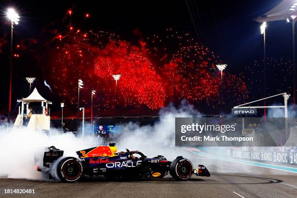 Race winner Max Verstappen of the Netherlands driving the Oracle Red Bull Racing RB19 performs donuts on track during the F1 Grand Prix of Abu Dhabi...