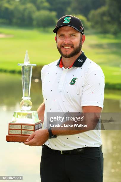 Dean Bermester of South Africa celebrates with the trophy after winning during Day Four of the Joburg Open at Houghton GC on November 26, 2023 in...