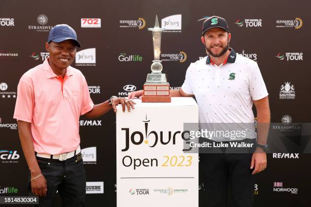 Dean Bermester of South Africa is presented with the trophy by Kabelo Gwamanda, Mayor of Johannesburg after winning during Day Four of the Joburg...