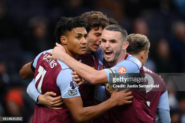 Pau Torres of Aston Villa celebrates with Ollie Watkins and John McGinn of Aston Villa after scoring the team's first goal to equalise during the...