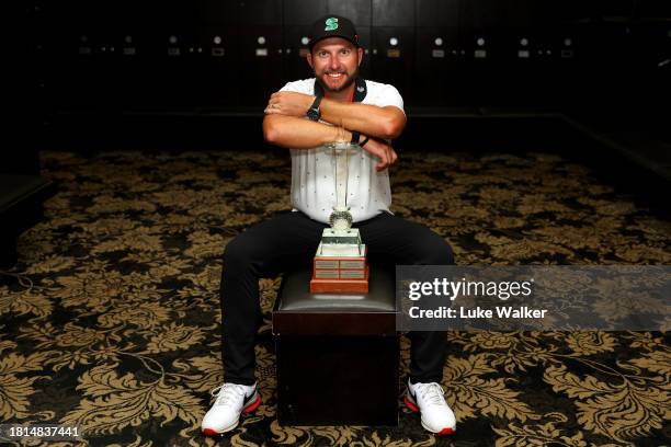 Dean Bermester of South Africa poses with the trophy in the locker room after winning during Day Four of the Joburg Open at Houghton GC on November...