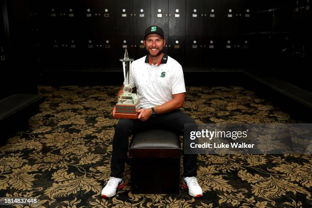 Dean Bermester of South Africa poses with the trophy in the locker room after winning during Day Four of the Joburg Open at Houghton GC on November...