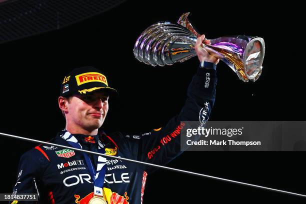 Race winner Max Verstappen of the Netherlands and Oracle Red Bull Racing celebrates on the podium during the F1 Grand Prix of Abu Dhabi at Yas Marina...