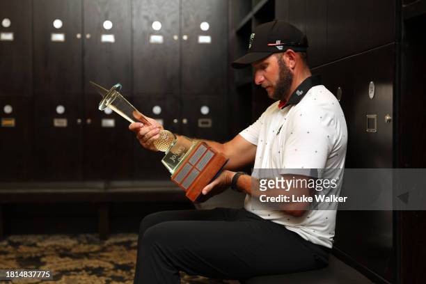 Dean Bermester of South Africa poses with the trophy in the locker room after winning during Day Four of the Joburg Open at Houghton GC on November...