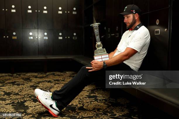 Dean Bermester of South Africa poses with the trophy in the locker room after winning during Day Four of the Joburg Open at Houghton GC on November...