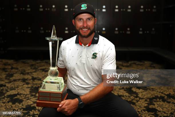 Dean Bermester of South Africa poses with the trophy in the locker room after winning during Day Four of the Joburg Open at Houghton GC on November...