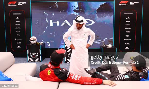 Mohammed ben Sulayem, FIA President talks to Second placed Charles Leclerc of Monaco and Ferrari and Third placed George Russell of Great Britain and...