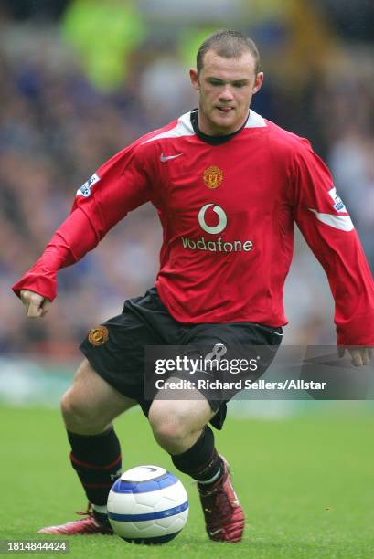 August 13: Wayne Rooney of Manchester United on the ball during the Premier League match between Everton and Manchester United at the Goodison Park...