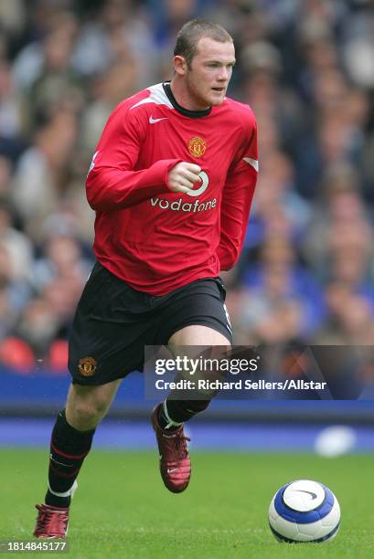 August 13: Wayne Rooney of Manchester United on the ball during the Premier League match between Everton and Manchester United at the Goodison Park...