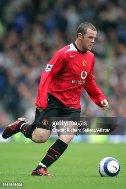 August 13: Wayne Rooney of Manchester United on the ball during the Premier League match between Everton and Manchester United at the Goodison Park...