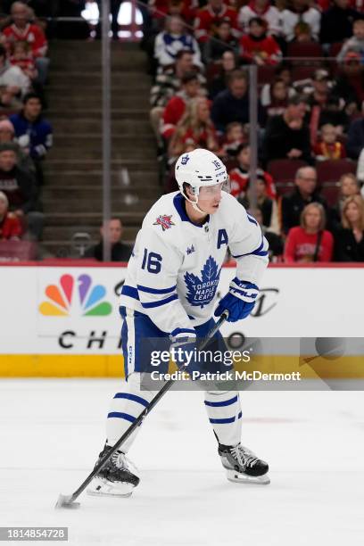 Mitchell Marner of the Toronto Maple Leafs skates with the puck against the Chicago Blackhawks during the first period at the United Center on...