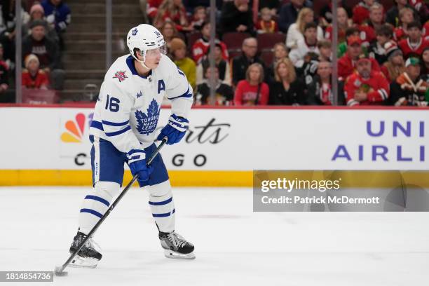 Mitchell Marner of the Toronto Maple Leafs skates with the puck against the Chicago Blackhawks during the first period at the United Center on...