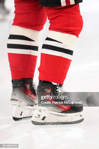 Detail view of the Bauer ice hockey skates worn by Connor Bedard of the Chicago Blackhawks as he warms up before a game against the Toronto Maple...