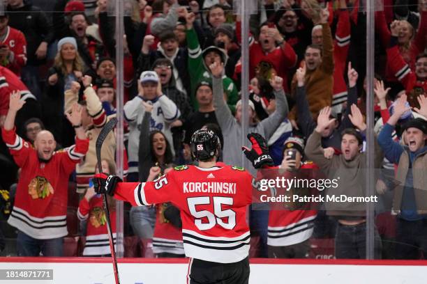 Kevin Korchinski of the Chicago Blackhawks celebrates after scoring the game winning goal against the Toronto Maple Leafs in overtime at the United...