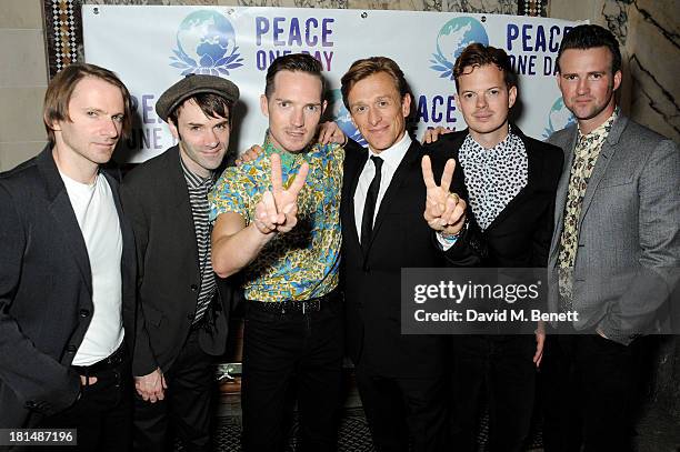 Peace One Day founder Jeremy Gilley poses with Kevin Jerimiah, Ciaran Jeramiah, Den Gillespie Sells, Richard Jones and Paul Stewart of The Feeling...