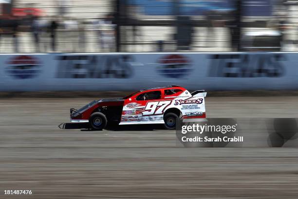 George White, driver of Modified, races during the Port-A-Cool U.S. National Dirt Track Championship at Texas Motor Speedway on September 21, 2013 in...