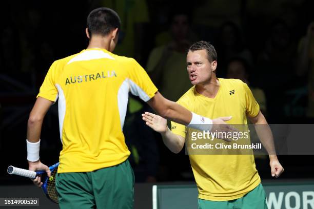 Lleyton Hewitt and Alexei Popyrin of Australia celebrate a point during the Davis Cup Final match against Matteo Arnaldi of Italy at Palacio de...
