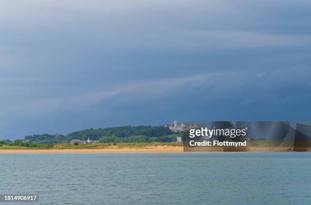 view over the bay of santander towards dunas del puntal y estuario del miera with in the background the former palace of the royal family, cantabria, spain - estuario stock pictures, royalty-free photos & images