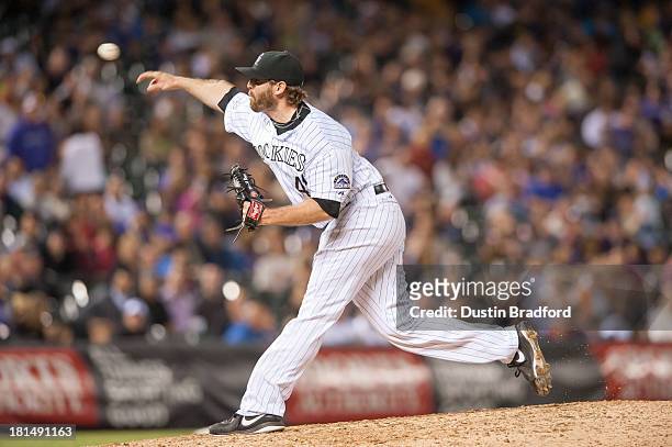 Mitchell Boggs of the Colorado Rockies pitches against the Arizona Diamondbacks during a game at Coors Field on September 20, 2013 in Denver,...
