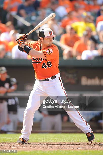 Chris Snyder of the Baltimore Orioles prepares for a pitch during a baseball game against the Chicago White Sox on September 7, 2013 at Oriole Park...