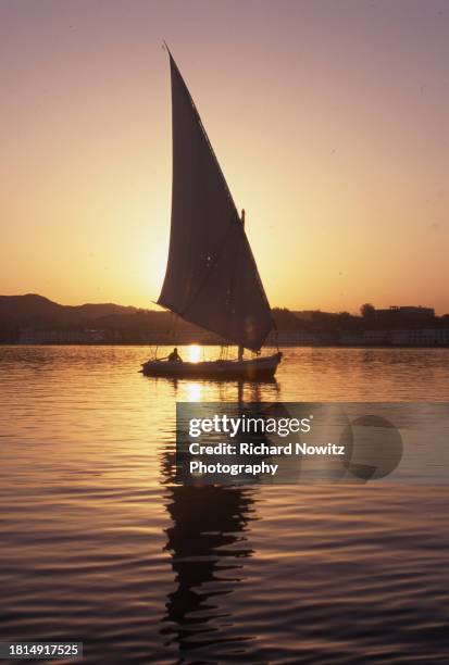 Felucca Sails on the Nile River at sunset in Aswan, Egypt. Sept. 10, 1995.