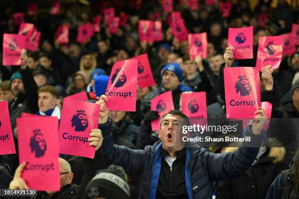 Fans of Everton hold protest banners following the clubs recent 10 point deduction for violating the Premier League's profit and sustainability rules...