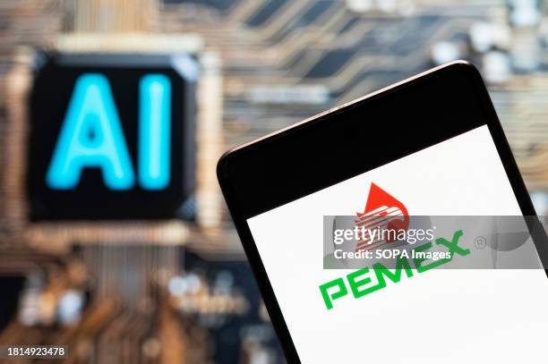 In this photo illustration, the Mexican oil and gas company Petróleos Mexicanos, better known as the Pemex, logo seen displayed on a smartphone with...