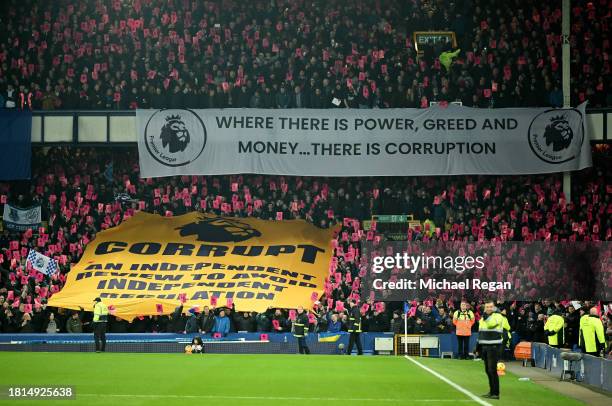 Fans of Everton hold protest banners following the clubs recent 10 point deduction for violating the Premier League's profit and sustainability rules...