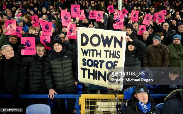 Fans of Everton hold protest banners following the clubs recent 10 point deduction for violating the Premier League's profit and sustainability rules...