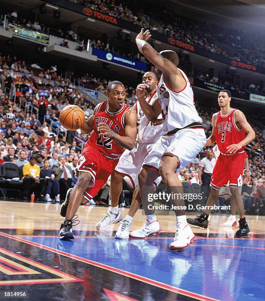 Jay Williams of the Chicago Bulls drives to the basket against Derrick Coleman of the Philadelphia 76ers during the NBA game at First Union Center on...