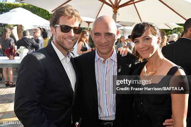 Actor Jamie Bamber, Michael Lewis, and actress Kerry Norton attend the BAFTA LA TV Tea 2013 presented by BBC America and Audi held at the SLS Hotel...