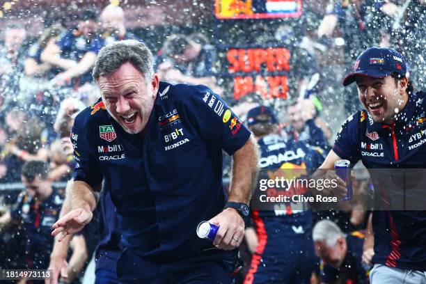 Red Bull Racing Team Principal Christian Horner and the Red Bull Racing team celebrate in the Pitlane after the F1 Grand Prix of Abu Dhabi at Yas...