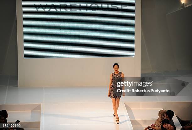 Model walks the runway at Warehouse Collection show during Ciputra World Fashion Week on September 21, 2013 in Surabaya, Indonesia.