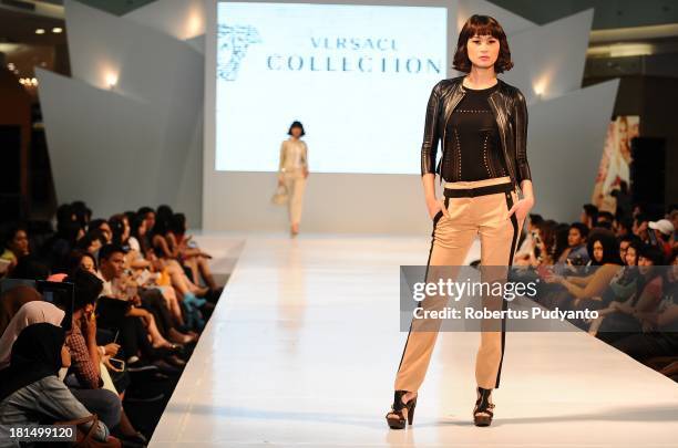 Model walks the runway at Versace Collection show during Ciputra World Fashion Week on September 21, 2013 in Surabaya, Indonesia.