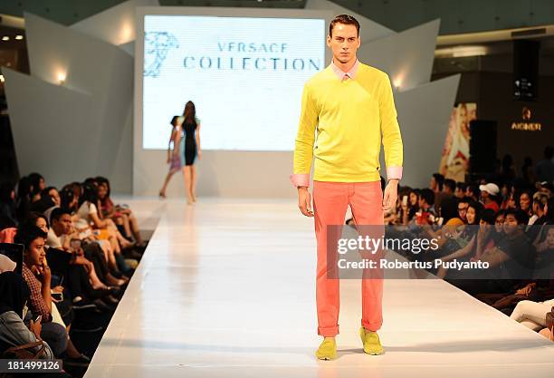 Model walks the runway at Versace Collection show during Ciputra World Fashion Week on September 21, 2013 in Surabaya, Indonesia.