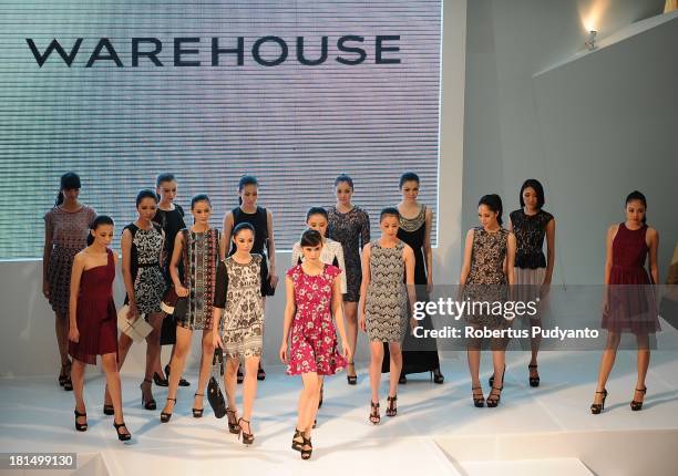 Model walk the runway at Warehouse Collection show during Ciputra World Fashion Week on September 21, 2013 in Surabaya, Indonesia.