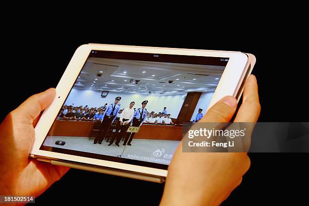 Ipad screen shows the picture of the sentence of Chinese politician Bo Xilai on September 22, 2013 in Beijing, China. The Jinan Intermediate People's...